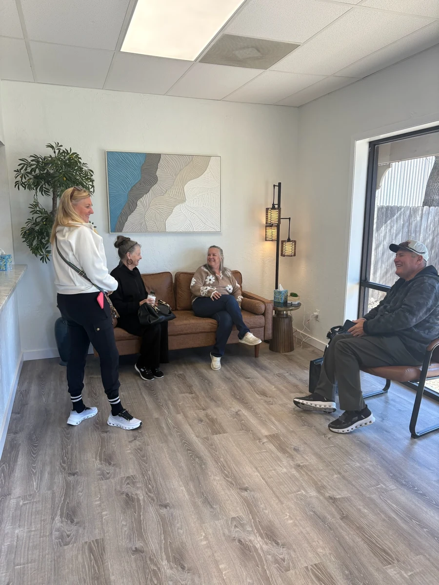 Patients relaxing in the reception area at Recalibrate Performance and Rehab in College Station, TX