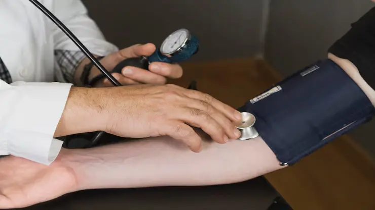 doctor-checking-blood-pressure_23-2147612162-1-2