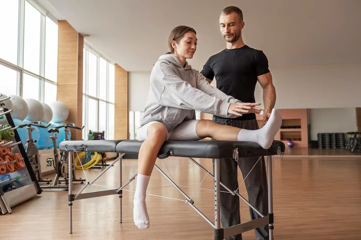 patient-doing-physical-rehabilitation-helped-by-therapists_23-2149227852 (1)