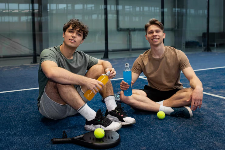 people-playing-padle-tennis-inside_23-2149444551